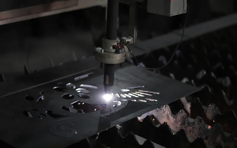 A cutting head slicing shapes out of steel plate