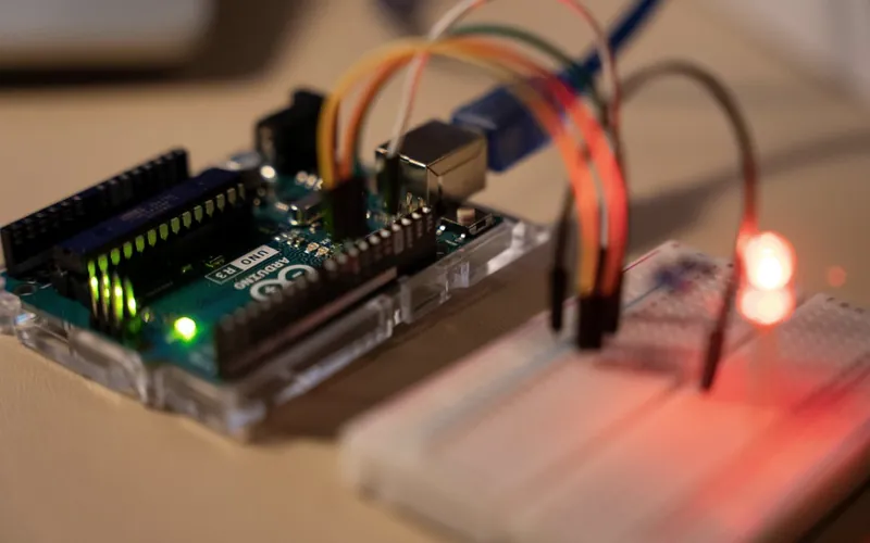 A microcontroller wired to a breadboard